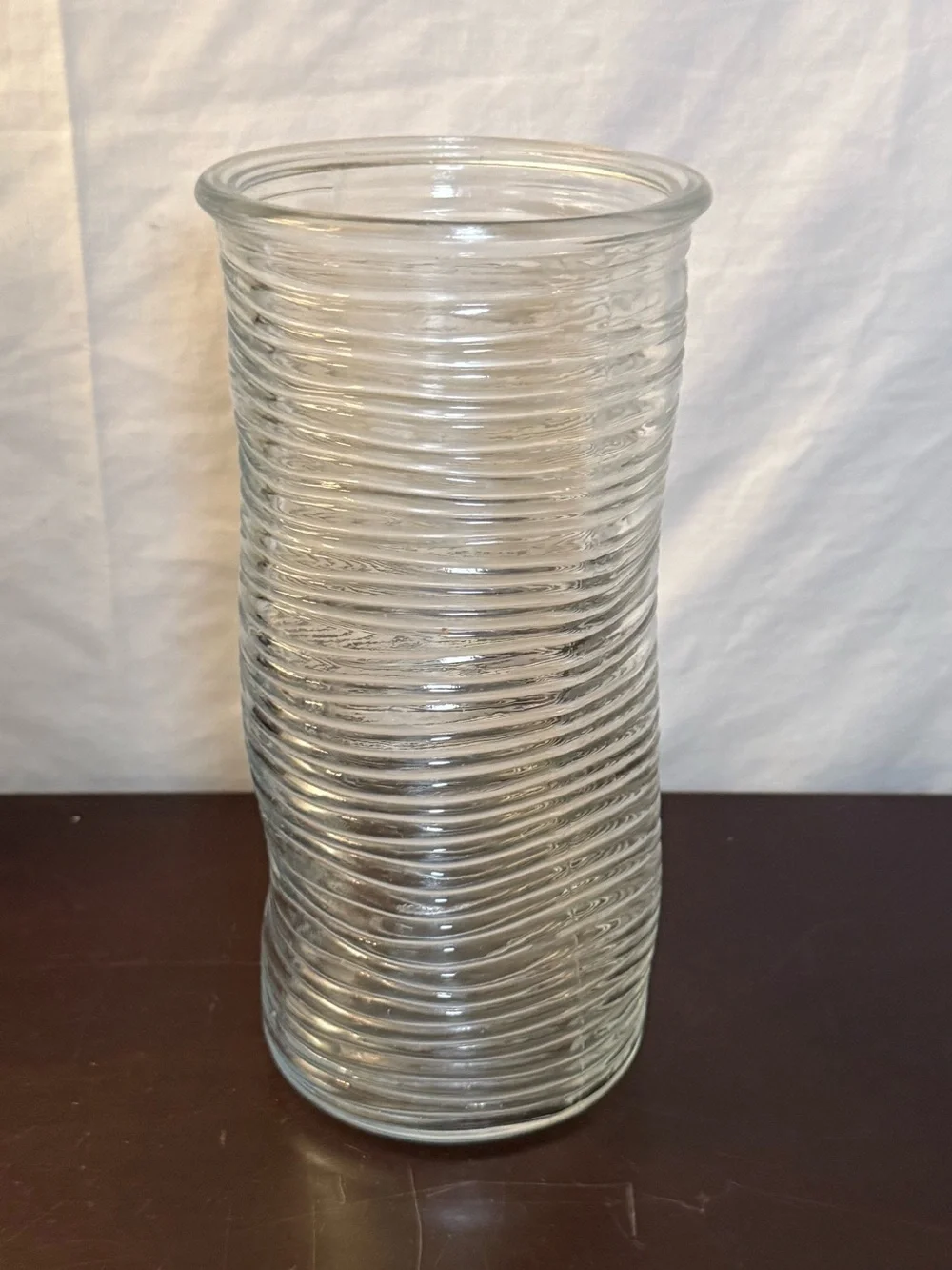 Ribbed glass vase, wavy, pinched shape. Mid-Century Modern design. 9.75”